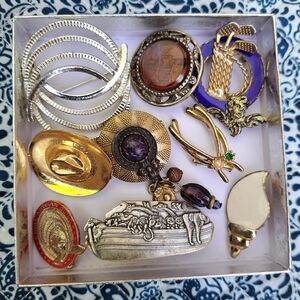 Vintage brooch lot shows wear